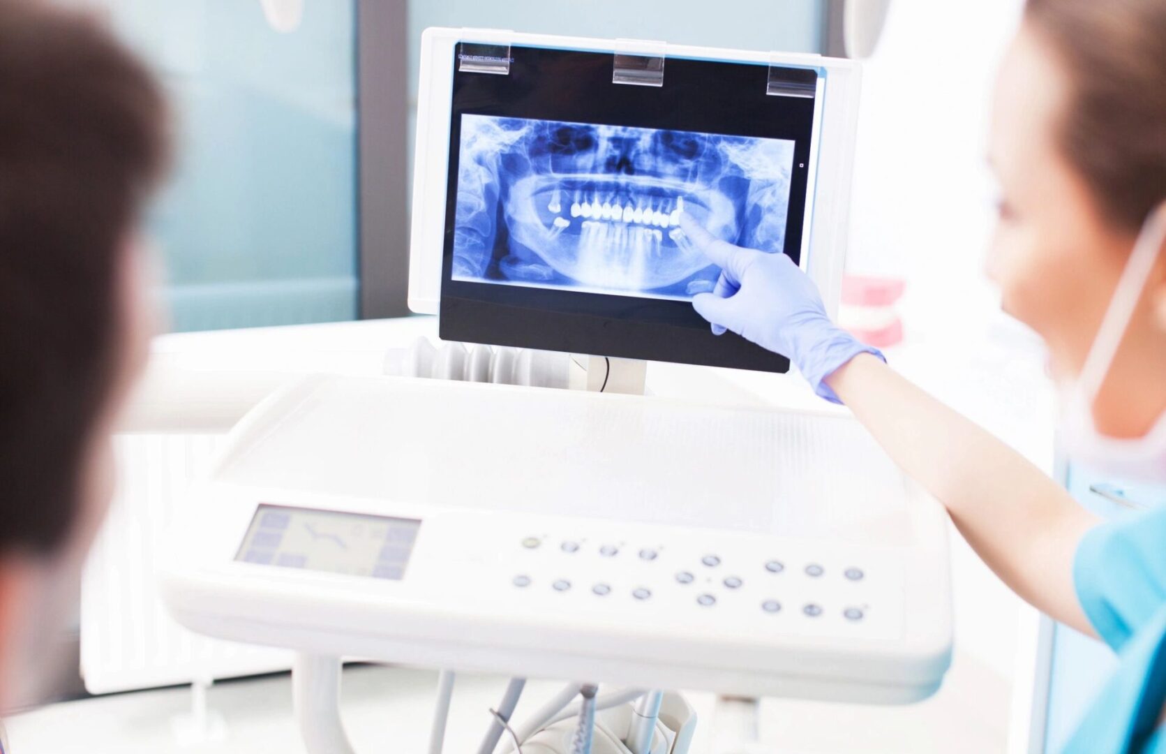A person is using an electronic device to view the teeth.
